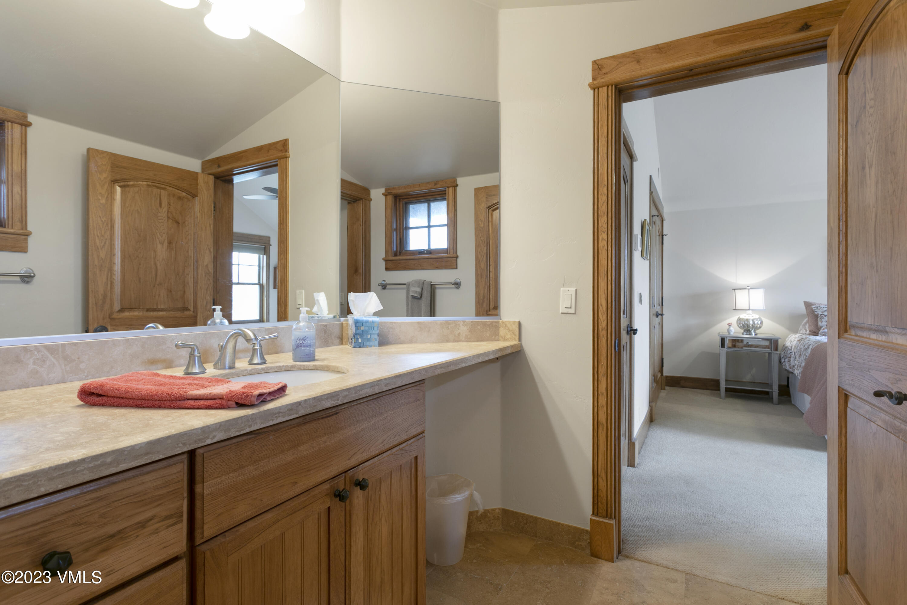 106 East Double Hitch Eagle, CO 81631 - Photo 15 of 28 a en suite bathroom with a granite countertop sink and a mirror