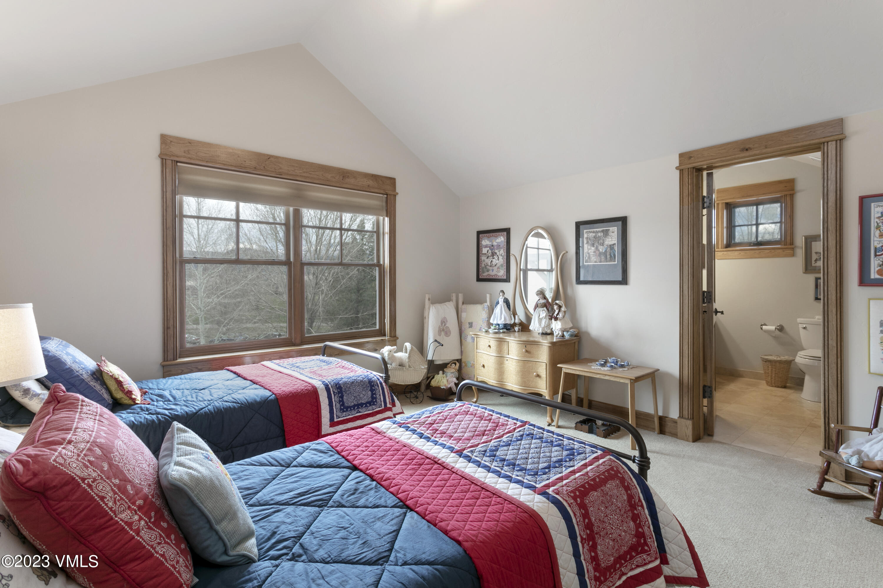 106 East Double Hitch Eagle, CO 81631 - Photo 17 of 28 a bedroom with two beds and a large window
