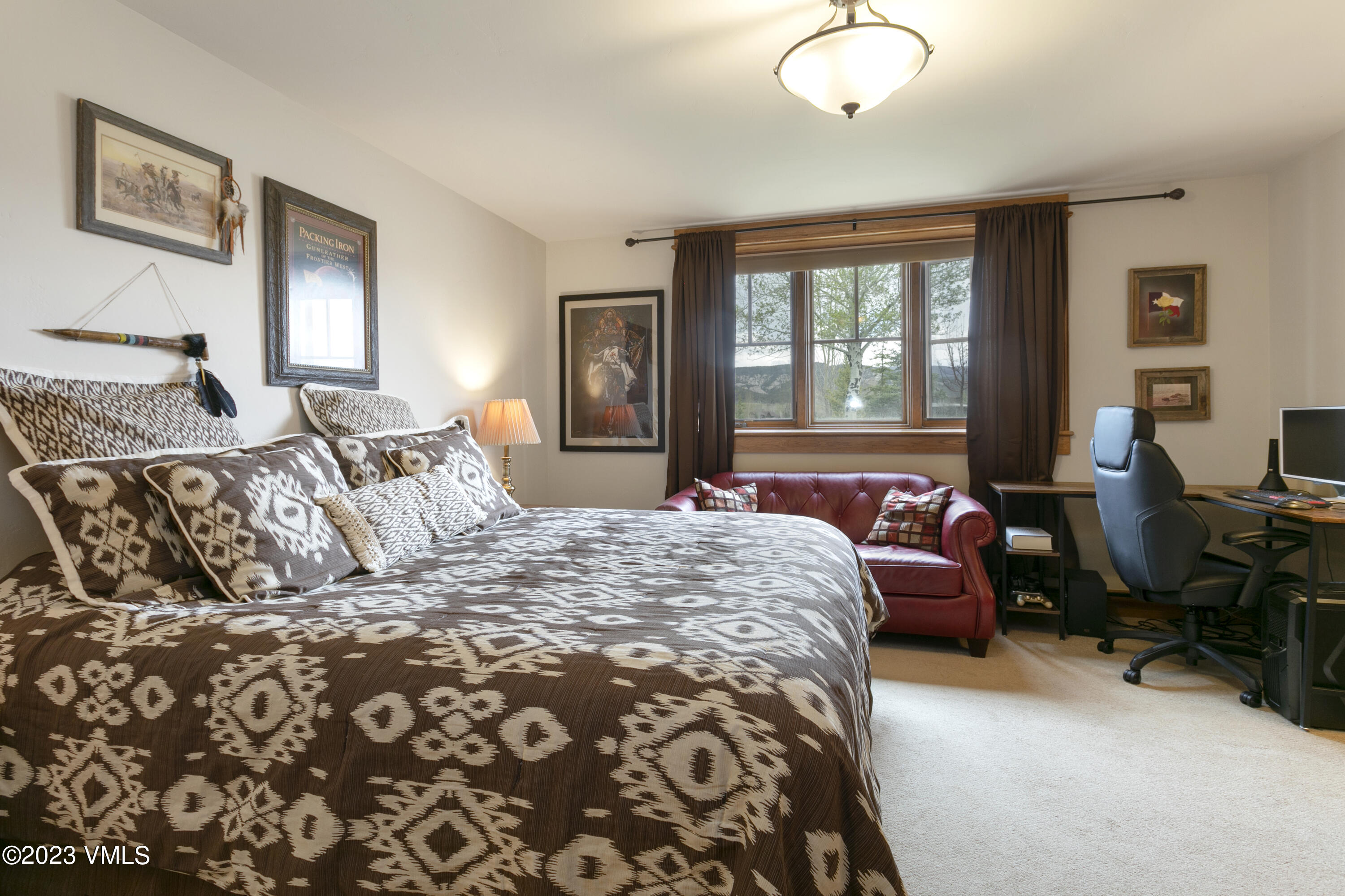 106 East Double Hitch Eagle, CO 81631 - Photo 20 of 28 a bedroom with a bed couch and a window