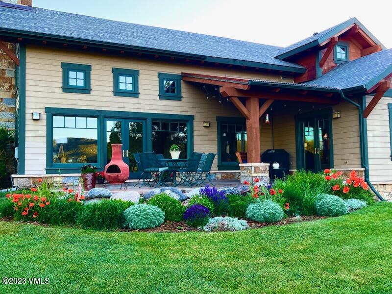 106 East Double Hitch Eagle, CO 81631 - Photo 28 of 28 a view of a chairs and table in front of a house