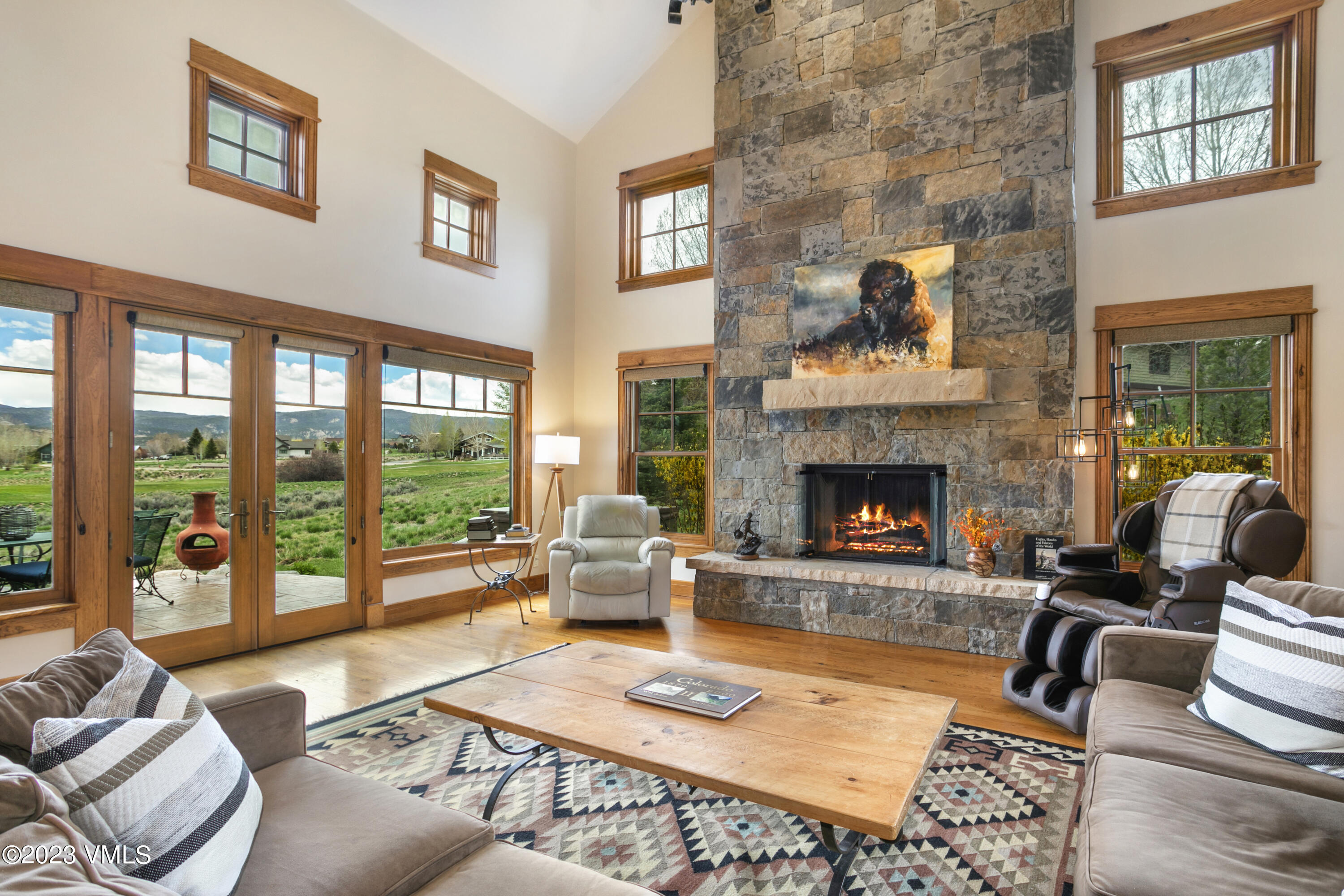 106 East Double Hitch Eagle, CO 81631 - Photo 7 of 28 a living room with furniture large window and a fireplace