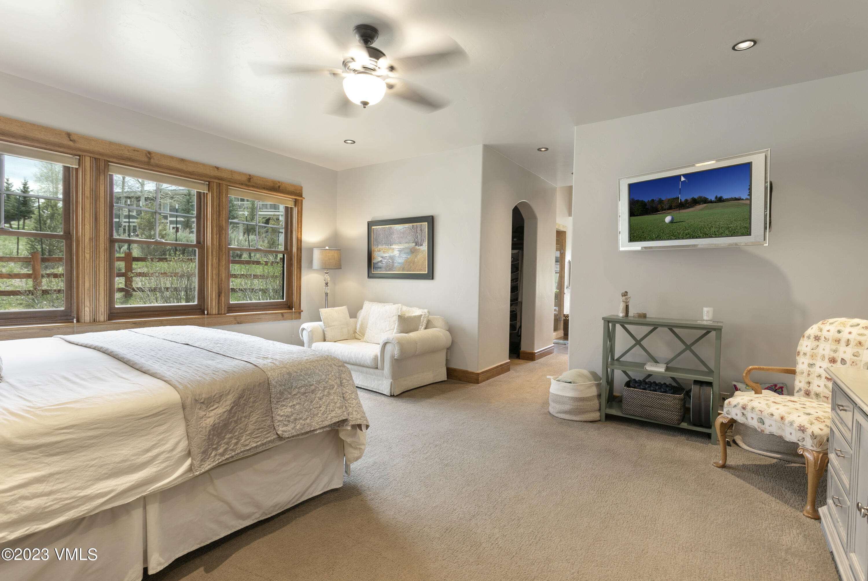 106 East Double Hitch Eagle, CO 81631 - Photo 10 of 28 a spacious bedroom with a bed and a couch