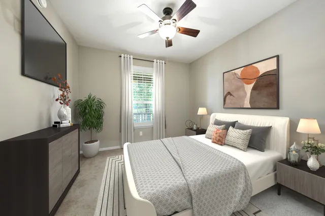 a view of a livingroom with a chandelier wooden floor and a kitchen