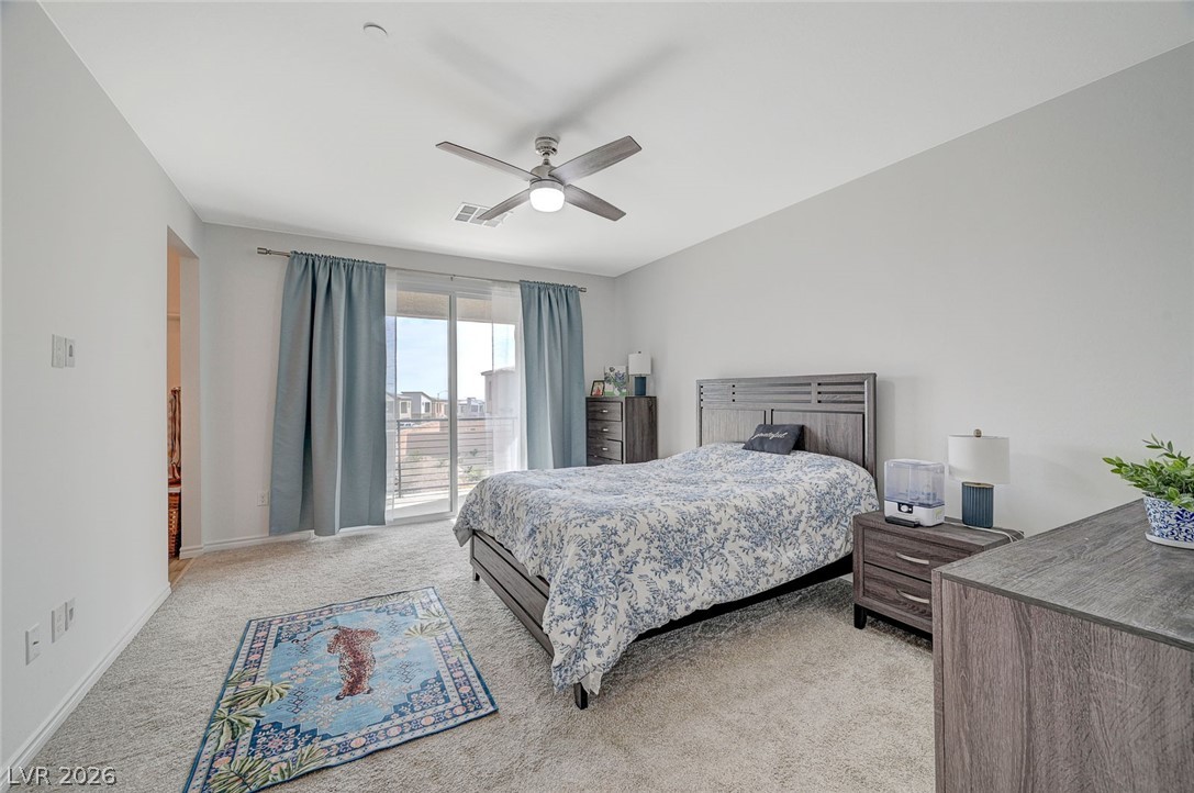8855 Roadrunner Ravine Street Las Vegas, NV 89166 - Photo 28 of 54 Bedroom featuring a ceiling fan, light carpet, visible vents, and baseboards