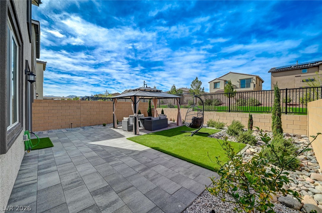 8855 Roadrunner Ravine Street Las Vegas, NV 89166 - Photo 39 of 54 View of patio with outdoor lounge area and a fenced backyard