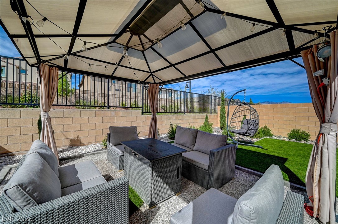8855 Roadrunner Ravine Street Las Vegas, NV 89166 - Photo 44 of 54 View of patio with a fenced backyard, outdoor lounge area, and a gazebo