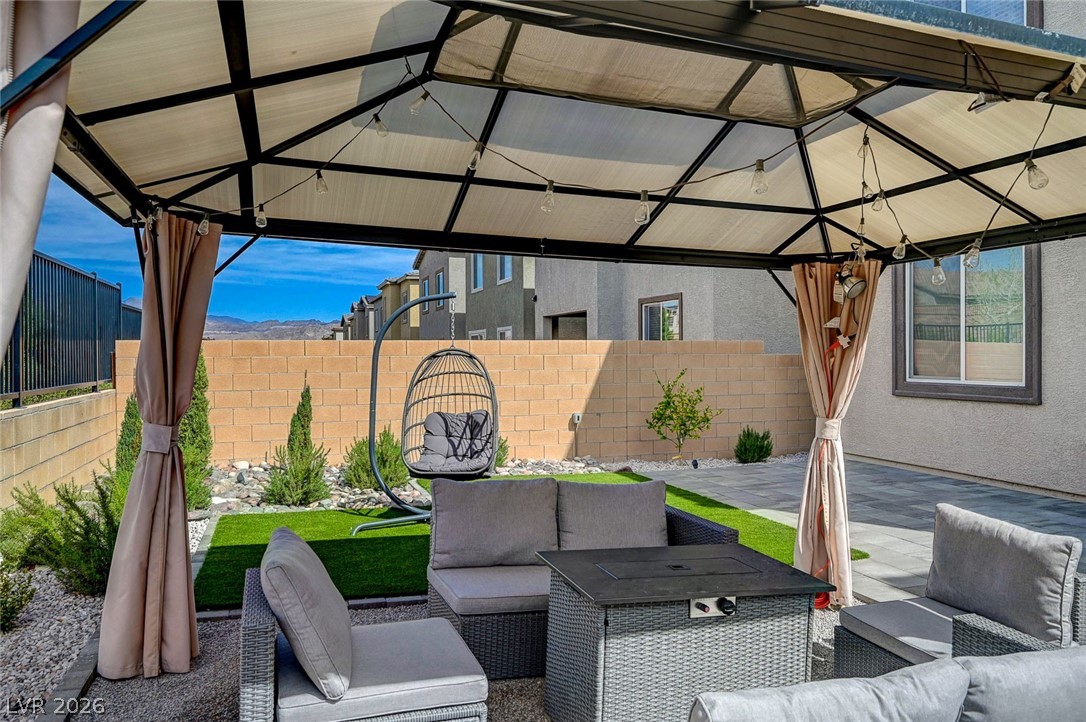 8855 Roadrunner Ravine Street Las Vegas, NV 89166 - Photo 45 of 54 View of patio / terrace featuring outdoor lounge area, fence, and a gazebo
