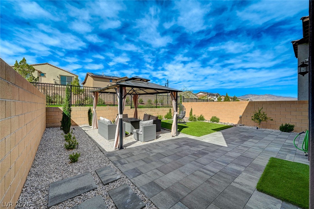 8855 Roadrunner Ravine Street Las Vegas, NV 89166 - Photo 46 of 54 View of patio / terrace featuring a gazebo, outdoor lounge area, and a fenced backyard