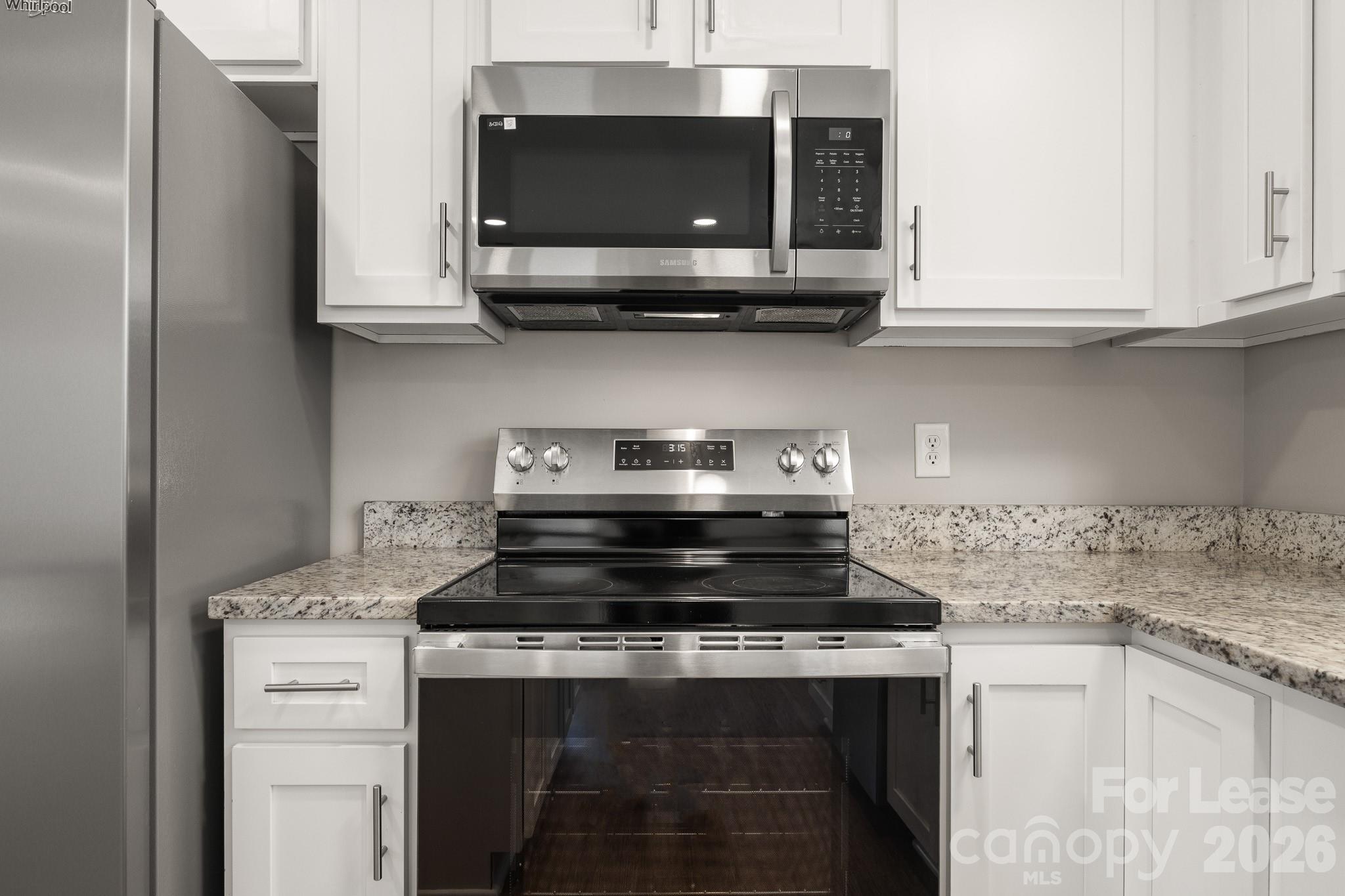 11805 Harrisburg Road Indian Land, SC 29707 - Photo 12 of 47 a stove top oven sitting inside of a kitchen