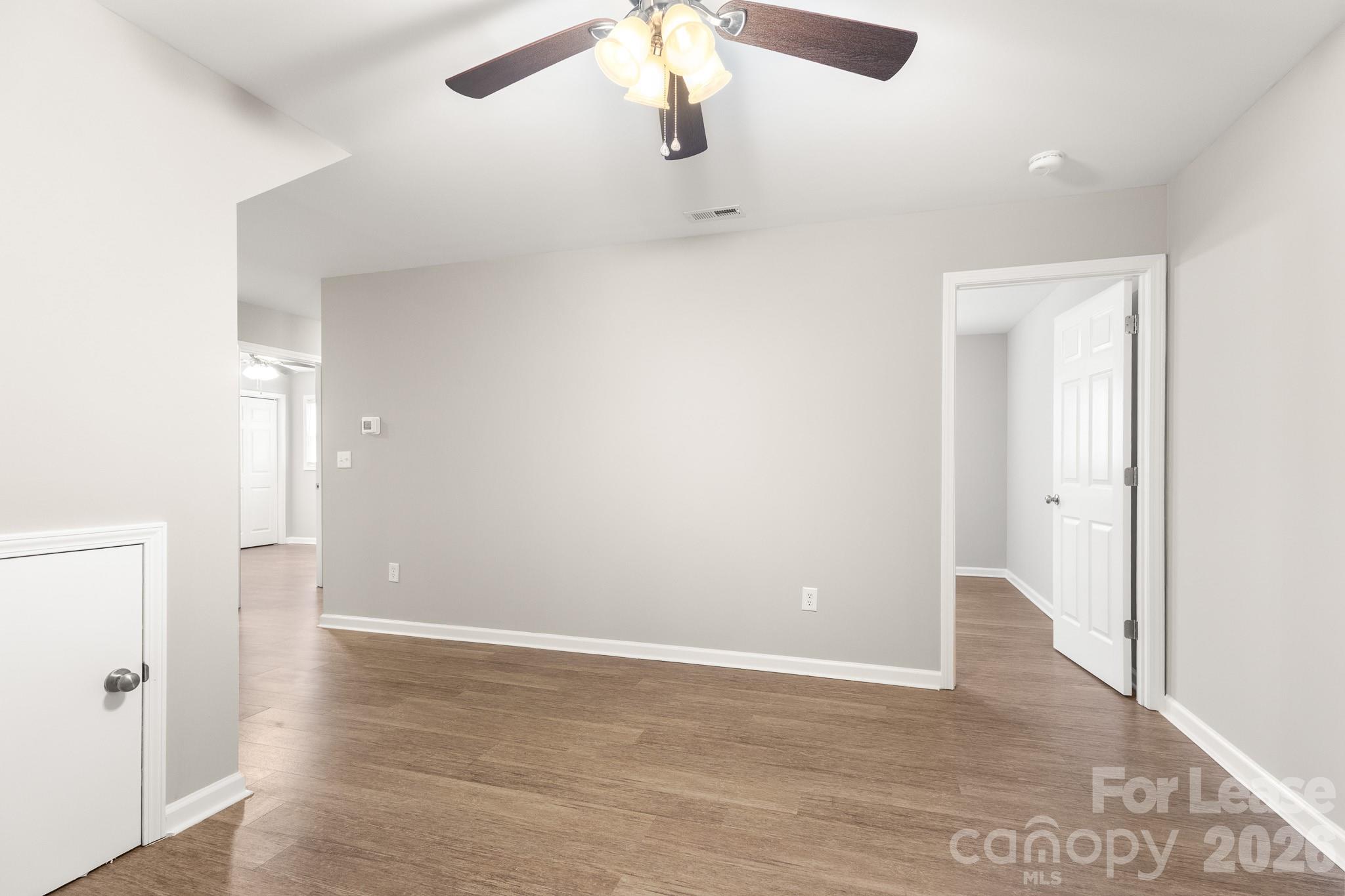 11805 Harrisburg Road Indian Land, SC 29707 - Photo 27 of 47 a view of an empty room with wooden floor