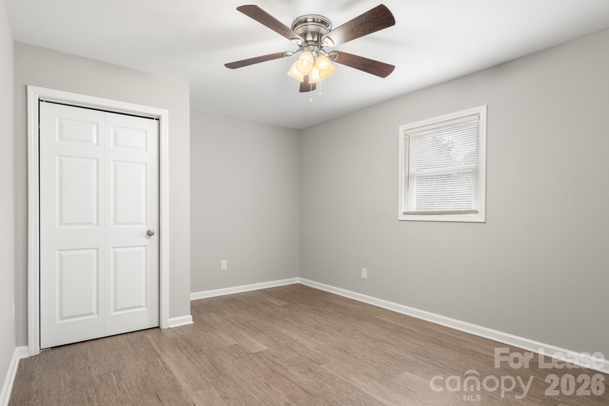 11805 Harrisburg Road Indian Land, SC 29707 - Photo 28 of 47 an empty room with fan and windows
