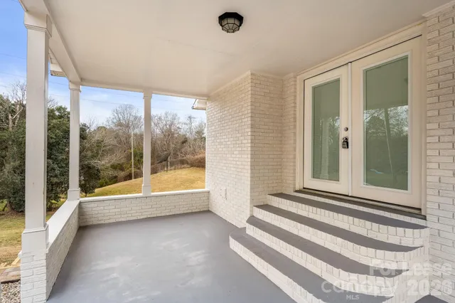 a view of a bathroom with a tub and shower
