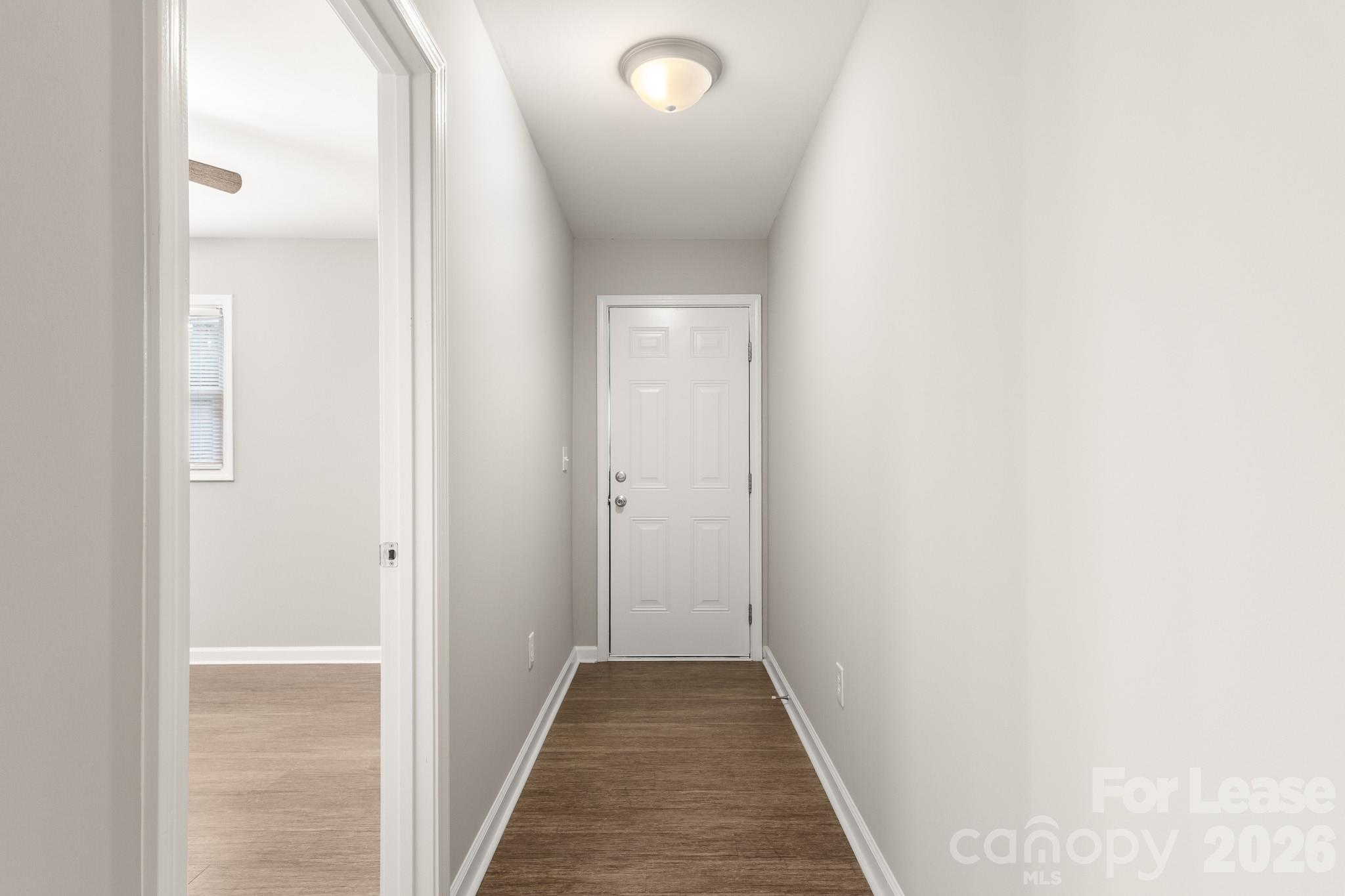 11805 Harrisburg Road Indian Land, SC 29707 - Photo 35 of 47 a view of a hallway with wooden floor