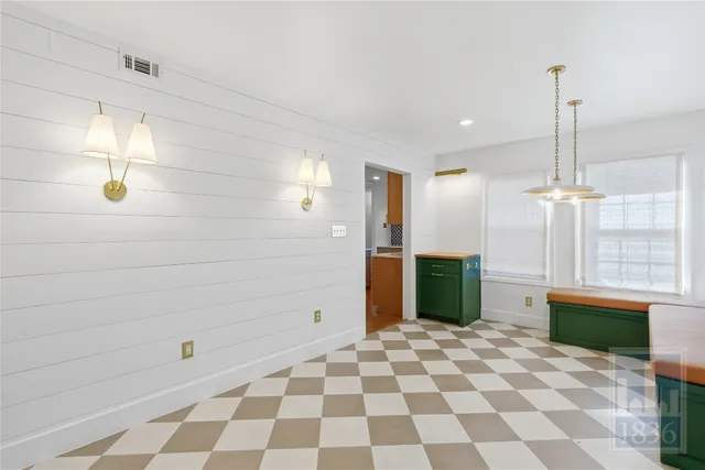 a bathroom with a sink a large mirror and a shower