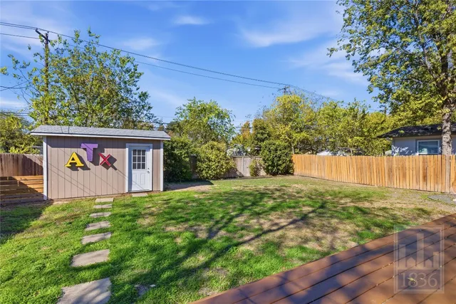 a view of a street with a tree