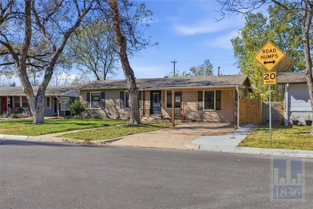 a view of a house with swimming pool and porch with furniture