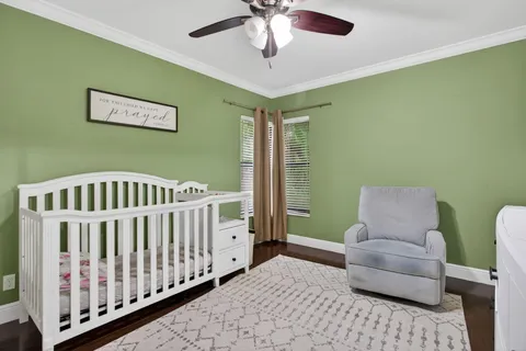 a bedroom with furniture and a window