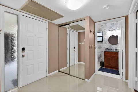 a view of kitchen with refrigerator and washer dryer