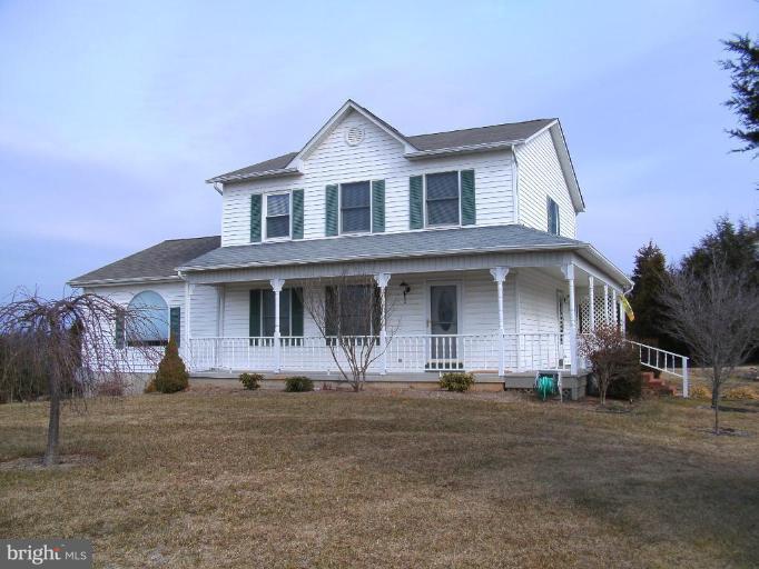121 Minebank Road Middletown, VA 22645 - Photo 1 of 26 a front view of a house with a yard
