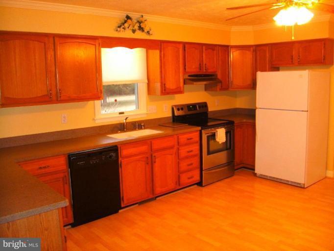 121 Minebank Road Middletown, VA 22645 - Photo 12 of 26 a kitchen that has a sink and a stove