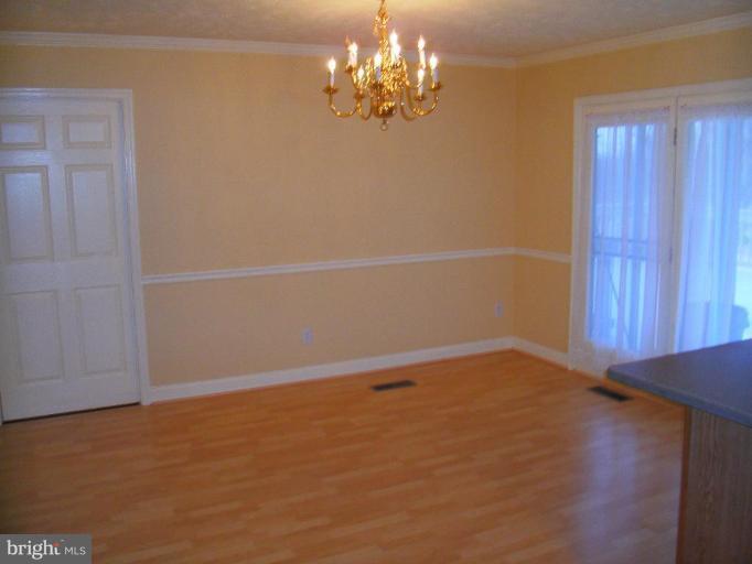121 Minebank Road Middletown, VA 22645 - Photo 13 of 26 a view of an empty room with chandelier fan