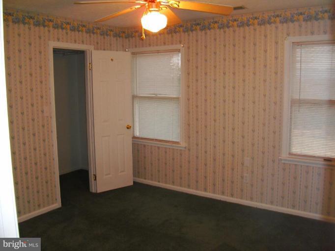 121 Minebank Road Middletown, VA 22645 - Photo 19 of 26 a view of an empty room with wooden floor