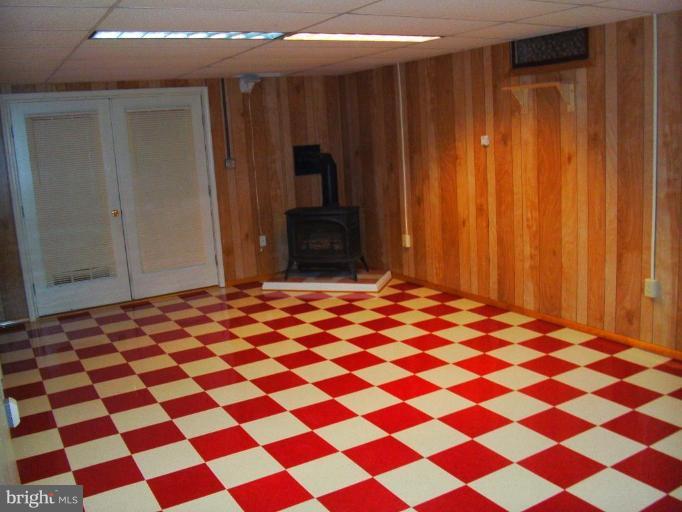 121 Minebank Road Middletown, VA 22645 - Photo 20 of 26 a bedroom with a black and white checkered floor