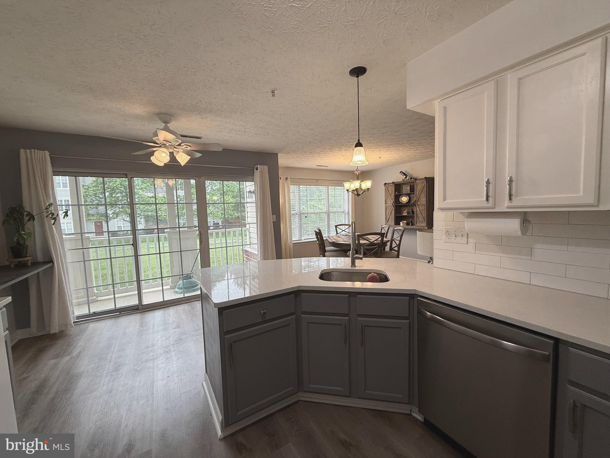 6343 Springwater Terrace, Unit 1012 Frederick, MD 21701 - Photo 12 of 39 a kitchen with a sink a window and appliances