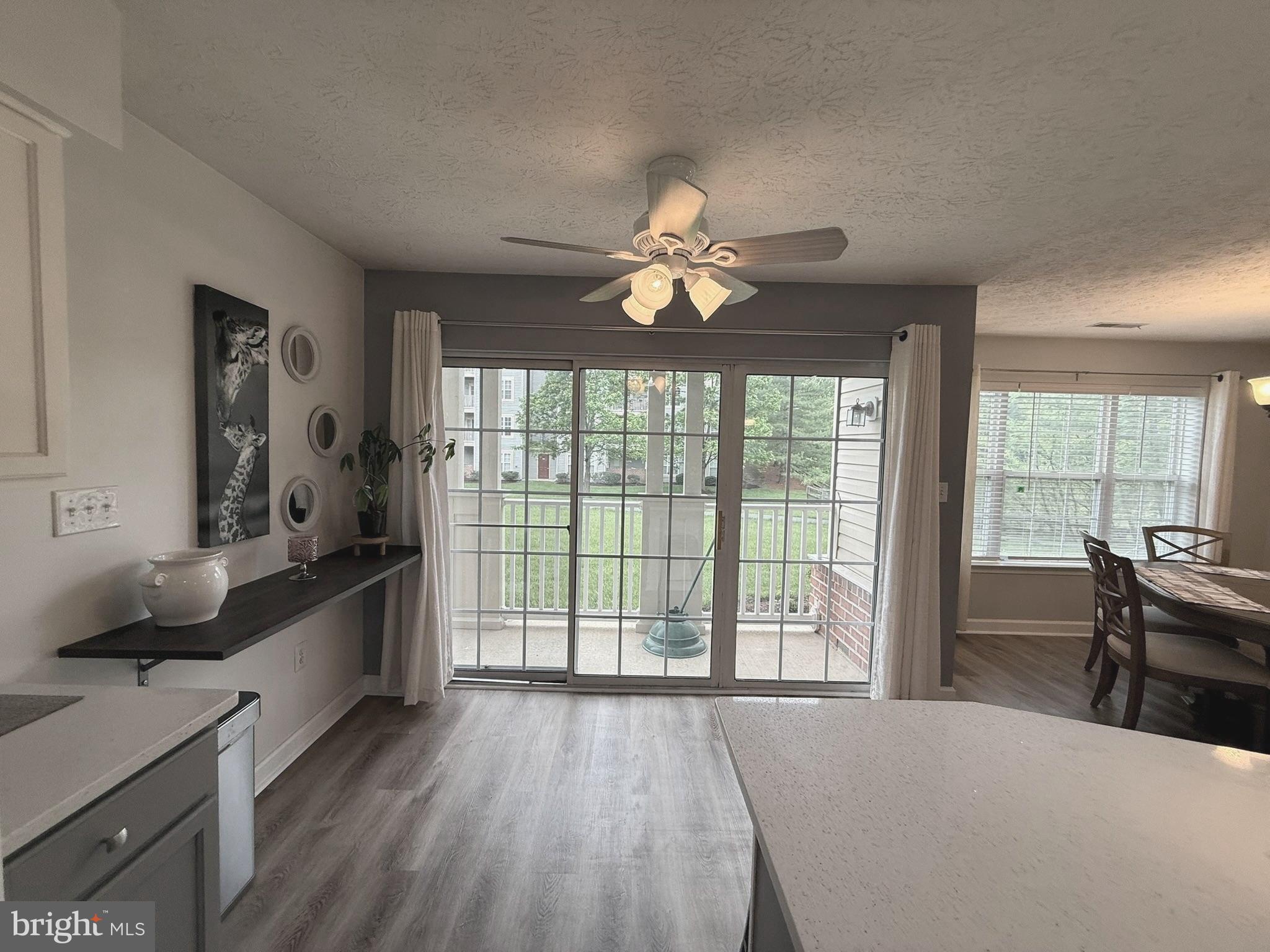 6343 Springwater Terrace, Unit 1012 Frederick, MD 21701 - Photo 13 of 39 a large living room with a large window