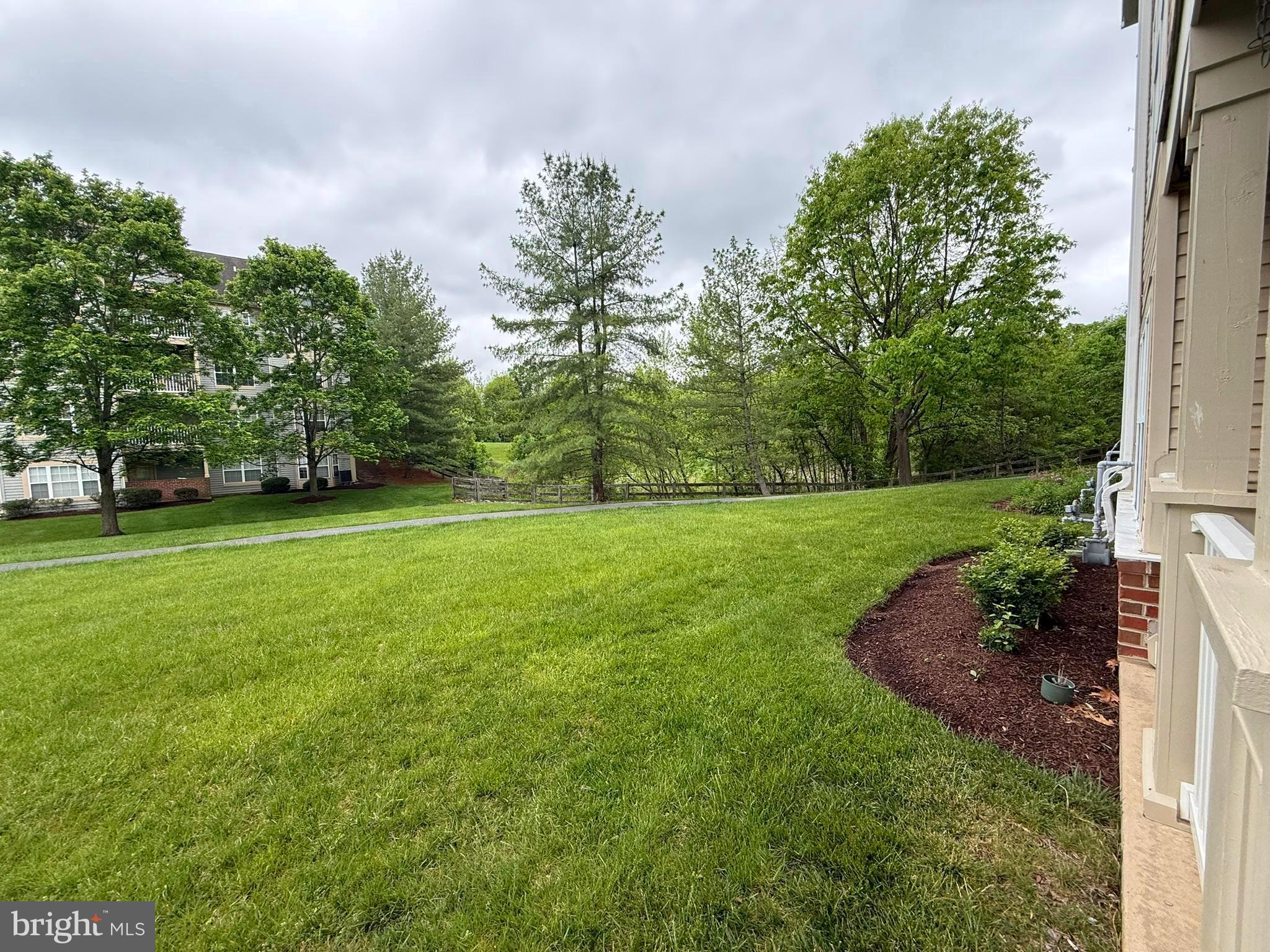 6343 Springwater Terrace, Unit 1012 Frederick, MD 21701 - Photo 18 of 39 a view of a grassy field with trees