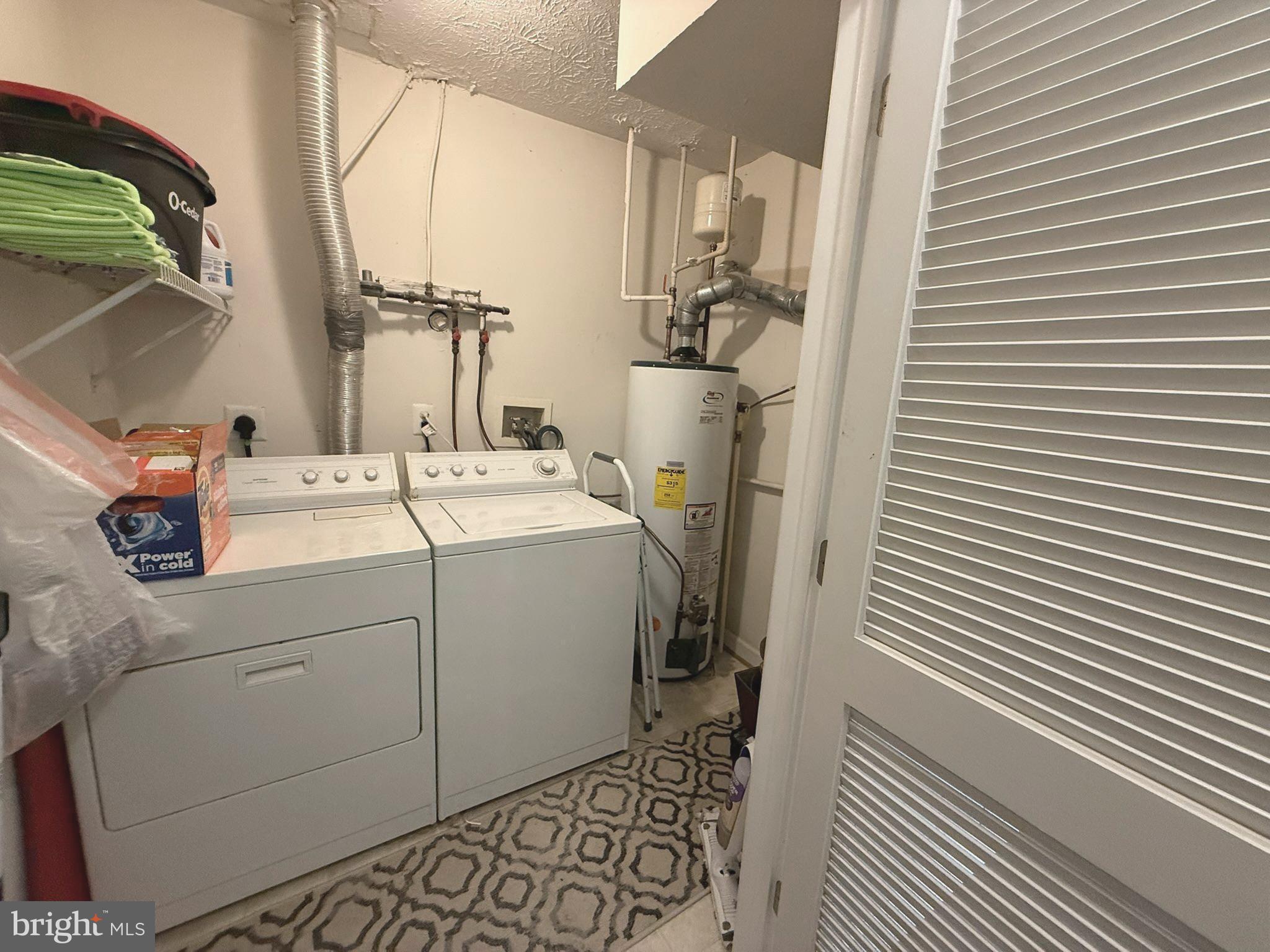 6343 Springwater Terrace, Unit 1012 Frederick, MD 21701 - Photo 24 of 39 a utility room with dryer and washer