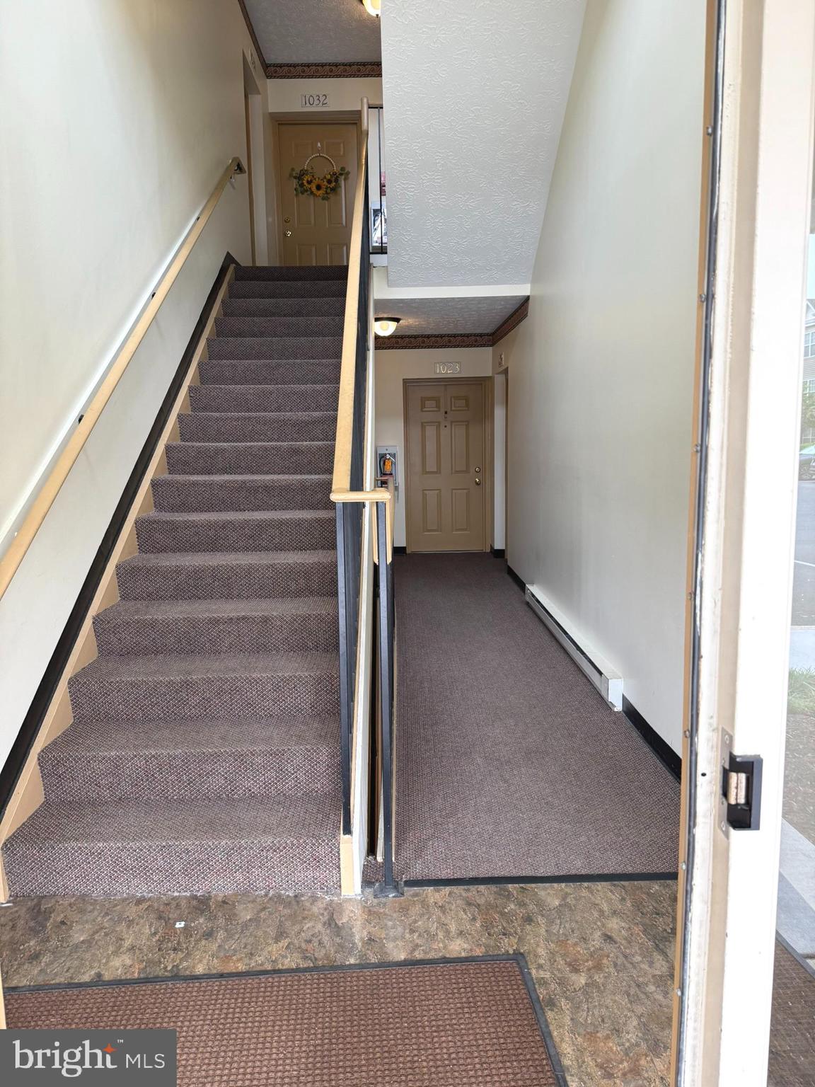 6343 Springwater Terrace, Unit 1012 Frederick, MD 21701 - Photo 37 of 39 a view of a hallway with staircase