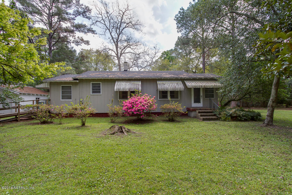 4621 Barnes Road South Jacksonville, FL 32207 - Photo 12 of 29 a front view of house with yard and trees all around