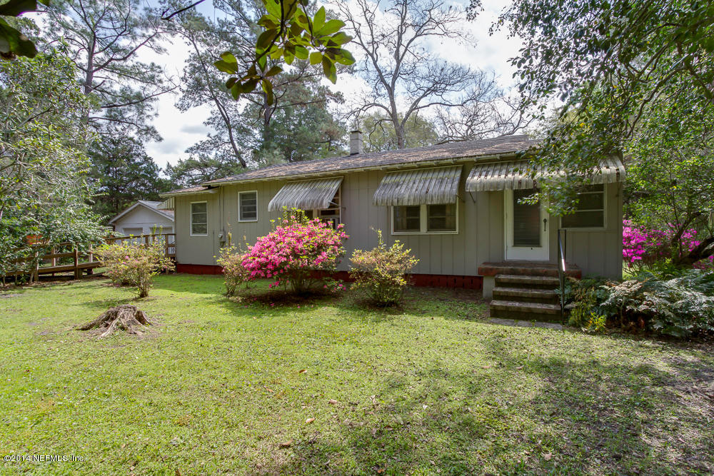 4621 Barnes Road South Jacksonville, FL 32207 - Photo 27 of 29 a front view of house with yard seating and green space
