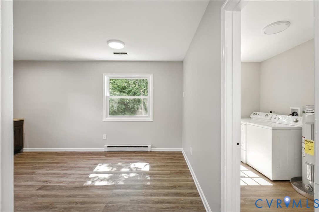 8522 Rainwater Road Richmond, VA 23237 - Photo 14 of 44 Washroom with light wood-style floors, washer and