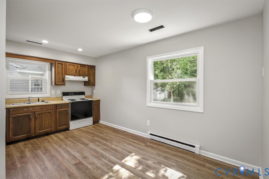 8522 Rainwater Road Richmond, VA 23237 - Photo 15 of 44 Kitchen featuring light countertops, white range w
