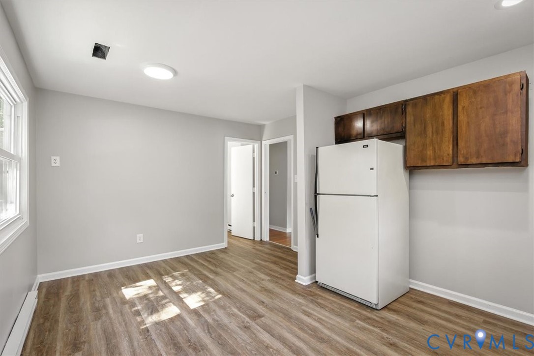 8522 Rainwater Road Richmond, VA 23237 - Photo 20 of 44 Kitchen with freestanding refrigerator, light wood