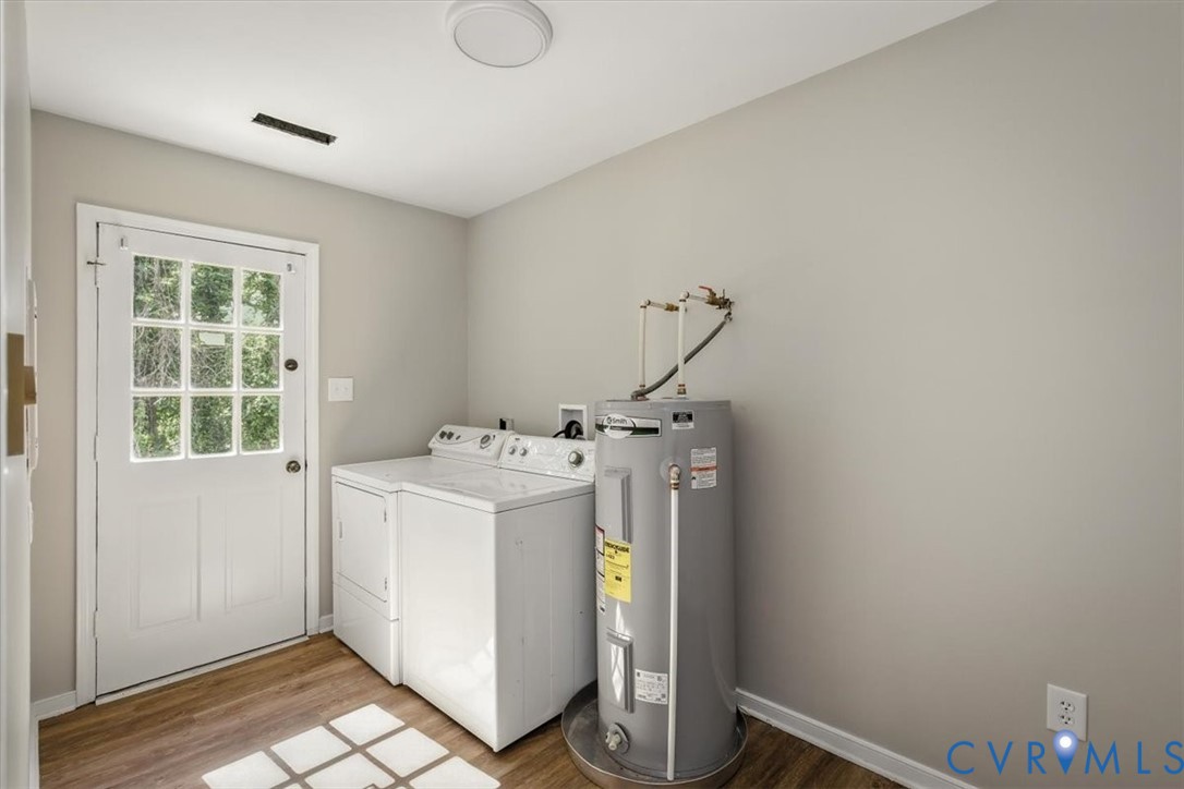8522 Rainwater Road Richmond, VA 23237 - Photo 23 of 44 Laundry room with water heater, dark wood-style fl