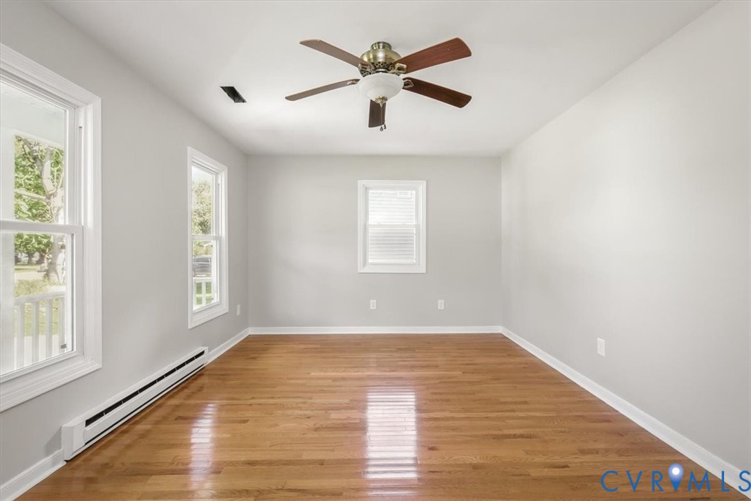 8522 Rainwater Road Richmond, VA 23237 - Photo 7 of 44 Empty room with a baseboard radiator, plenty of na