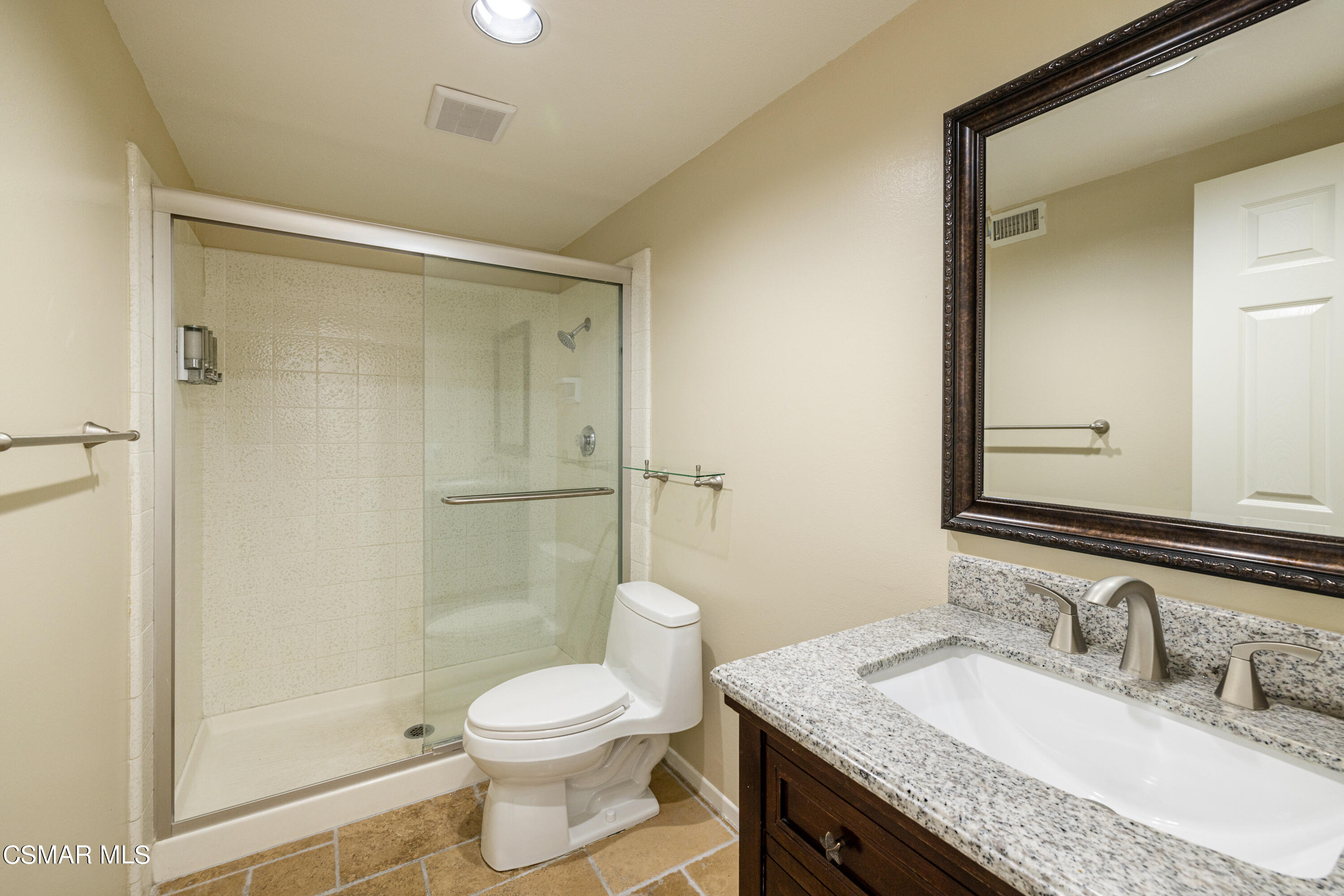 2456 Victoria Street Simi Valley, CA 93065 - Photo 11 of 24 a bathroom with a granite countertop sink toilet and shower
