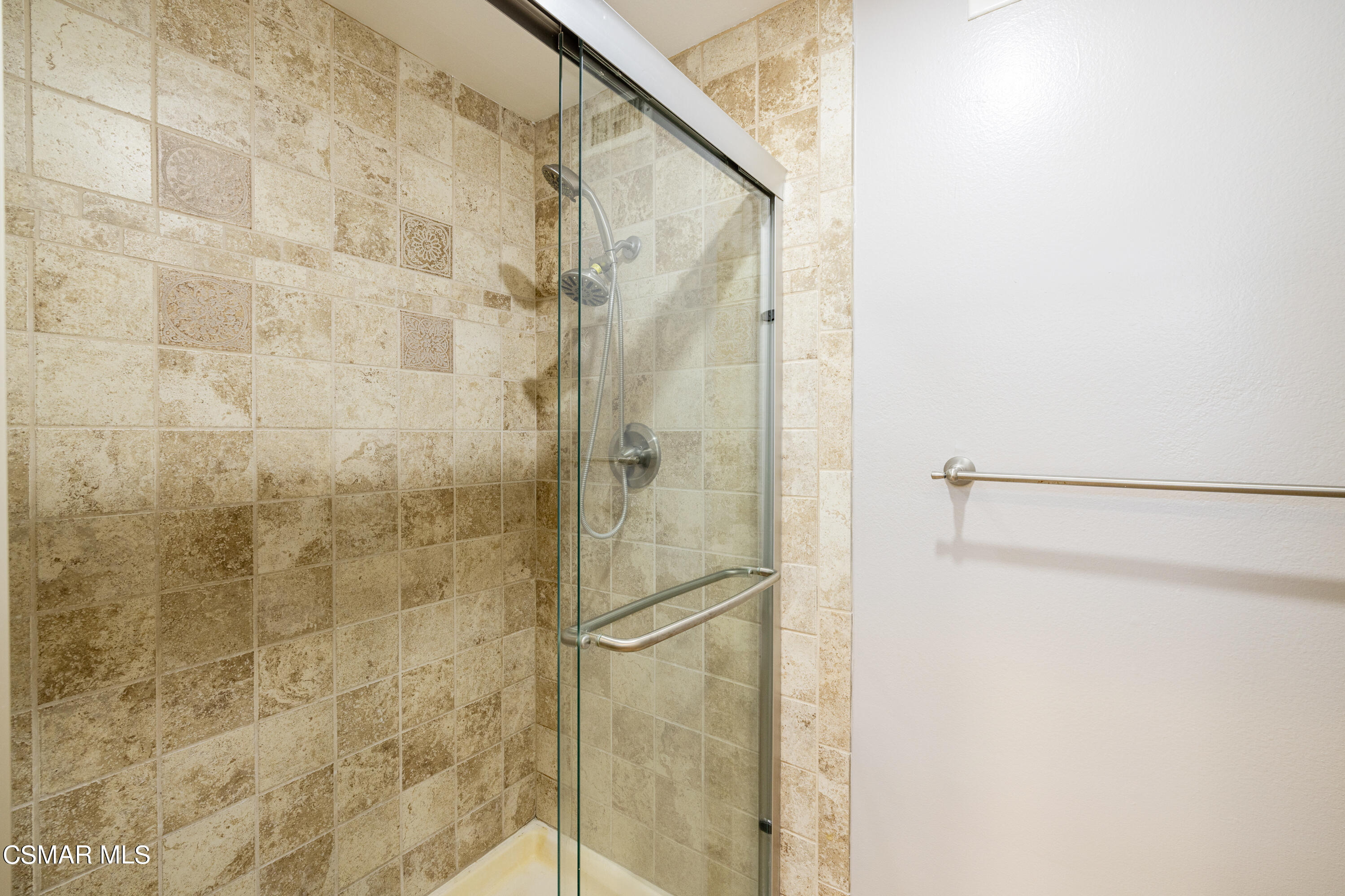 2456 Victoria Street Simi Valley, CA 93065 - Photo 15 of 24 a bathroom with a glass shower door