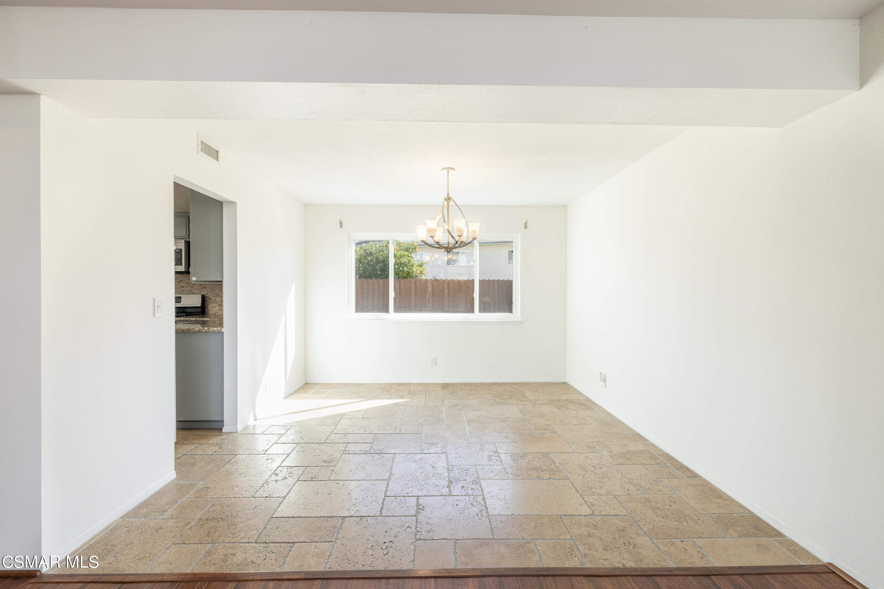 2456 Victoria Street Simi Valley, CA 93065 - Photo 5 of 24 an empty room with windows and chandelier