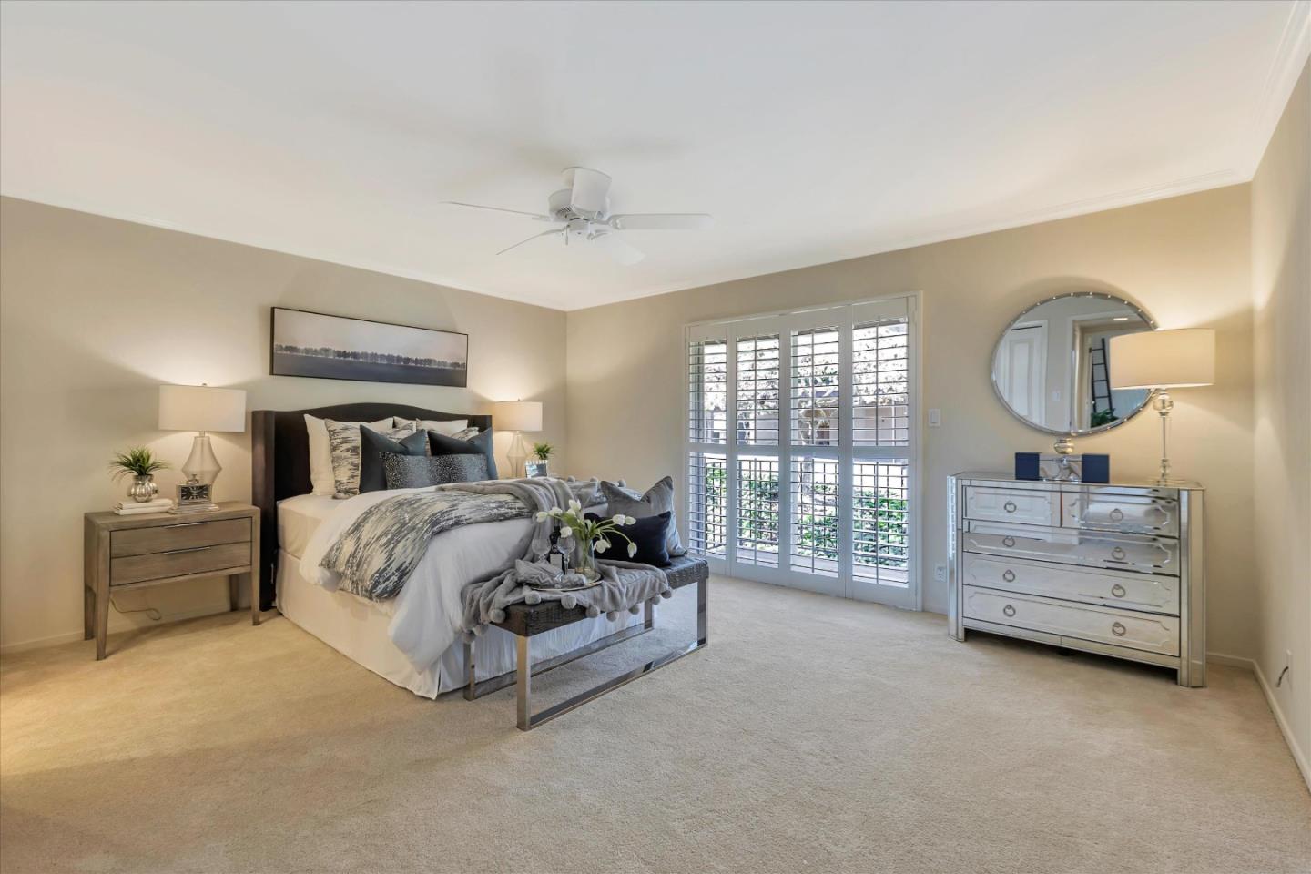 18400 Overlook Road, Unit 35 Los Gatos, CA 95030 - Photo 12 of 28 a bed room with a bed and a chandelier
