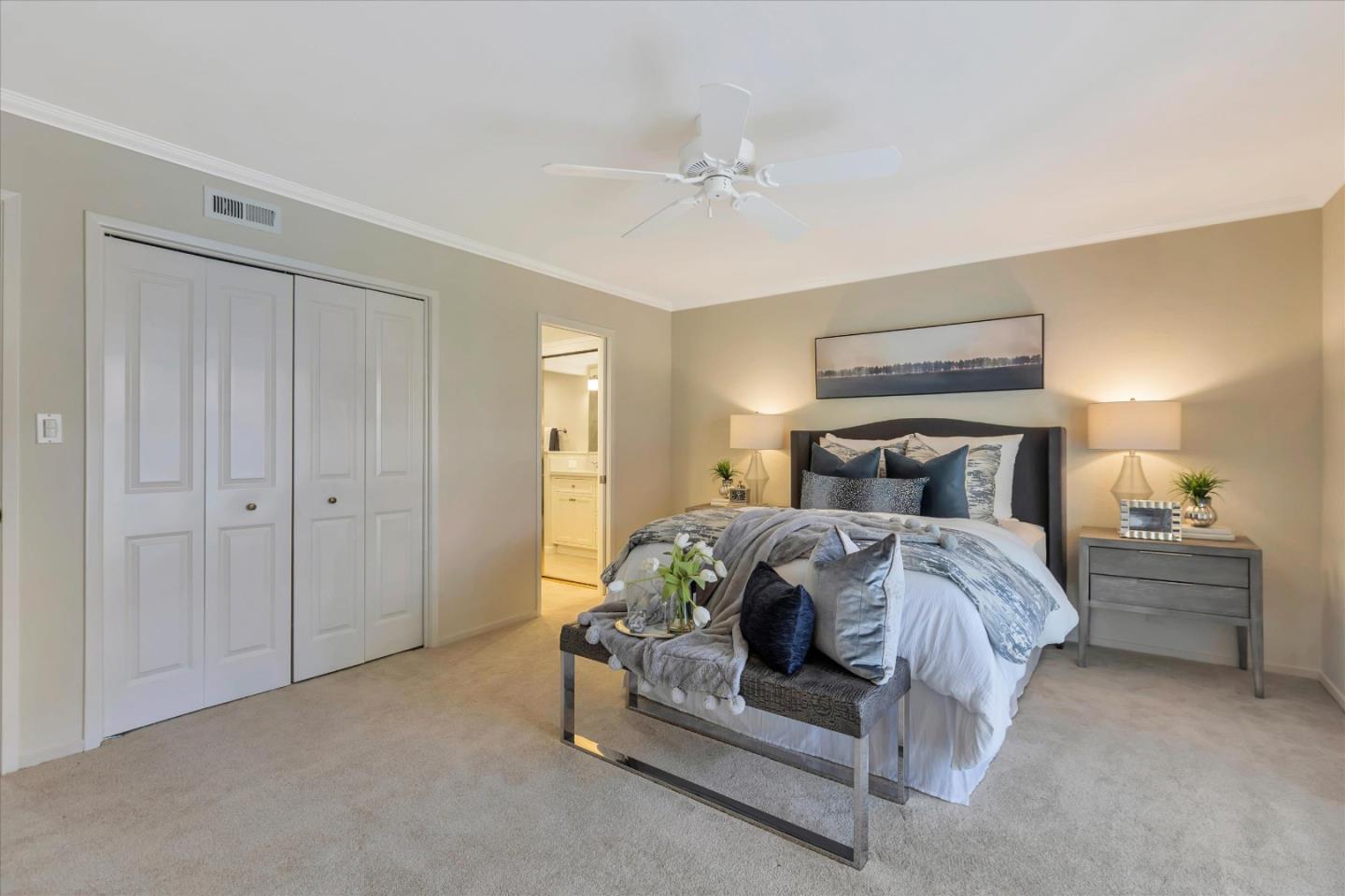 18400 Overlook Road, Unit 35 Los Gatos, CA 95030 - Photo 13 of 28 a bedroom with a bed and a chandelier