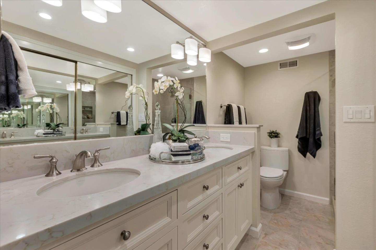 18400 Overlook Road, Unit 35 Los Gatos, CA 95030 - Photo 14 of 28 a bathroom with a double vanity sink and a mirror