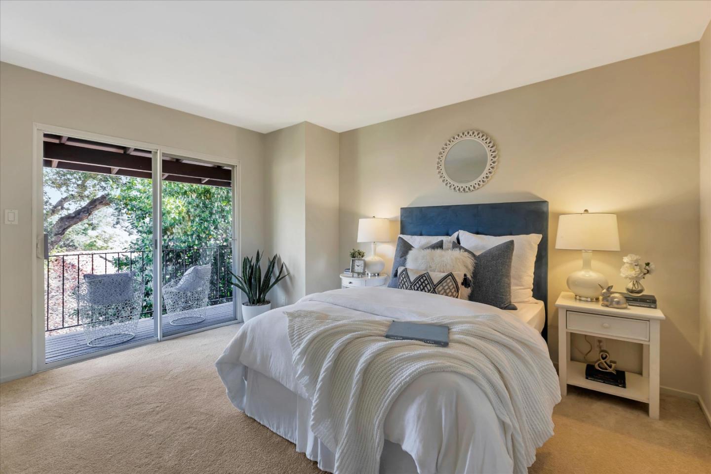 18400 Overlook Road, Unit 35 Los Gatos, CA 95030 - Photo 16 of 28 a large bed sitting in a bedroom next to a window