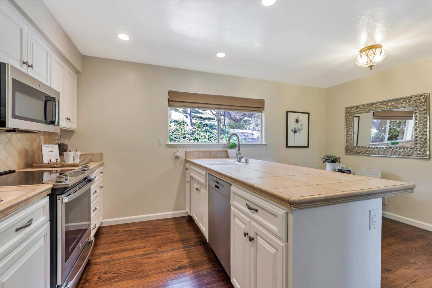 18400 Overlook Road, Unit 35 Los Gatos, CA 95030 - Photo 8 of 28 a kitchen with a stove and a sink