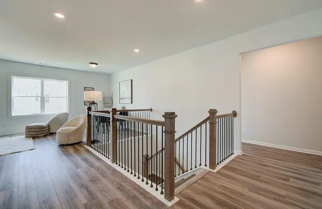 a view of a livingroom with furniture and windows
