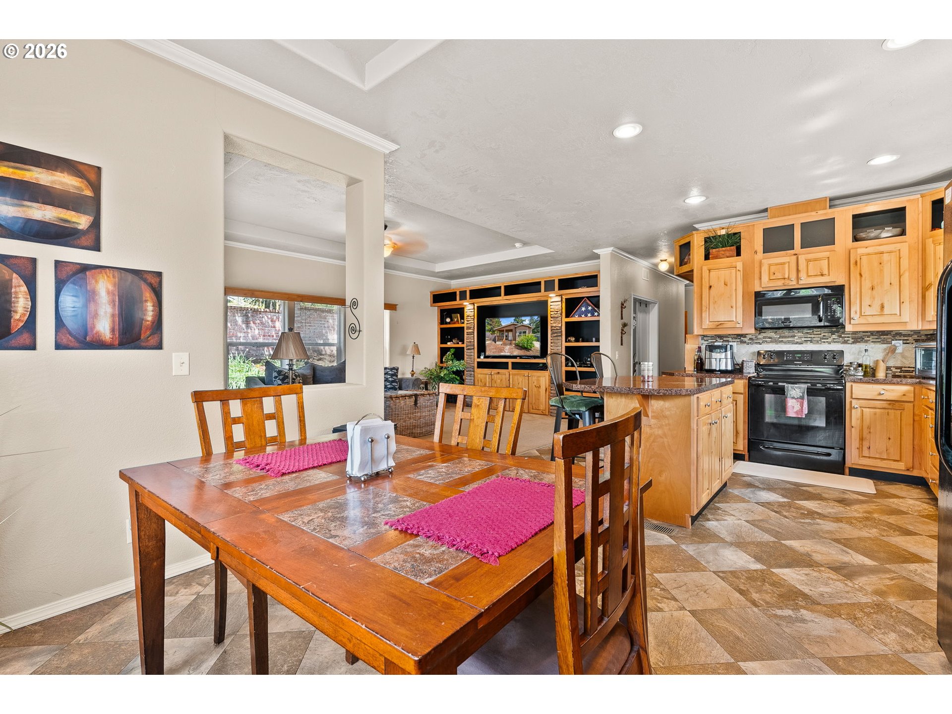 13620 Southwest Beef Bend Road, Unit 1 Portland, OR 97224 - Photo 11 of 34 a living room with stainless steel appliances kitchen island granite countertop furniture and a dining table