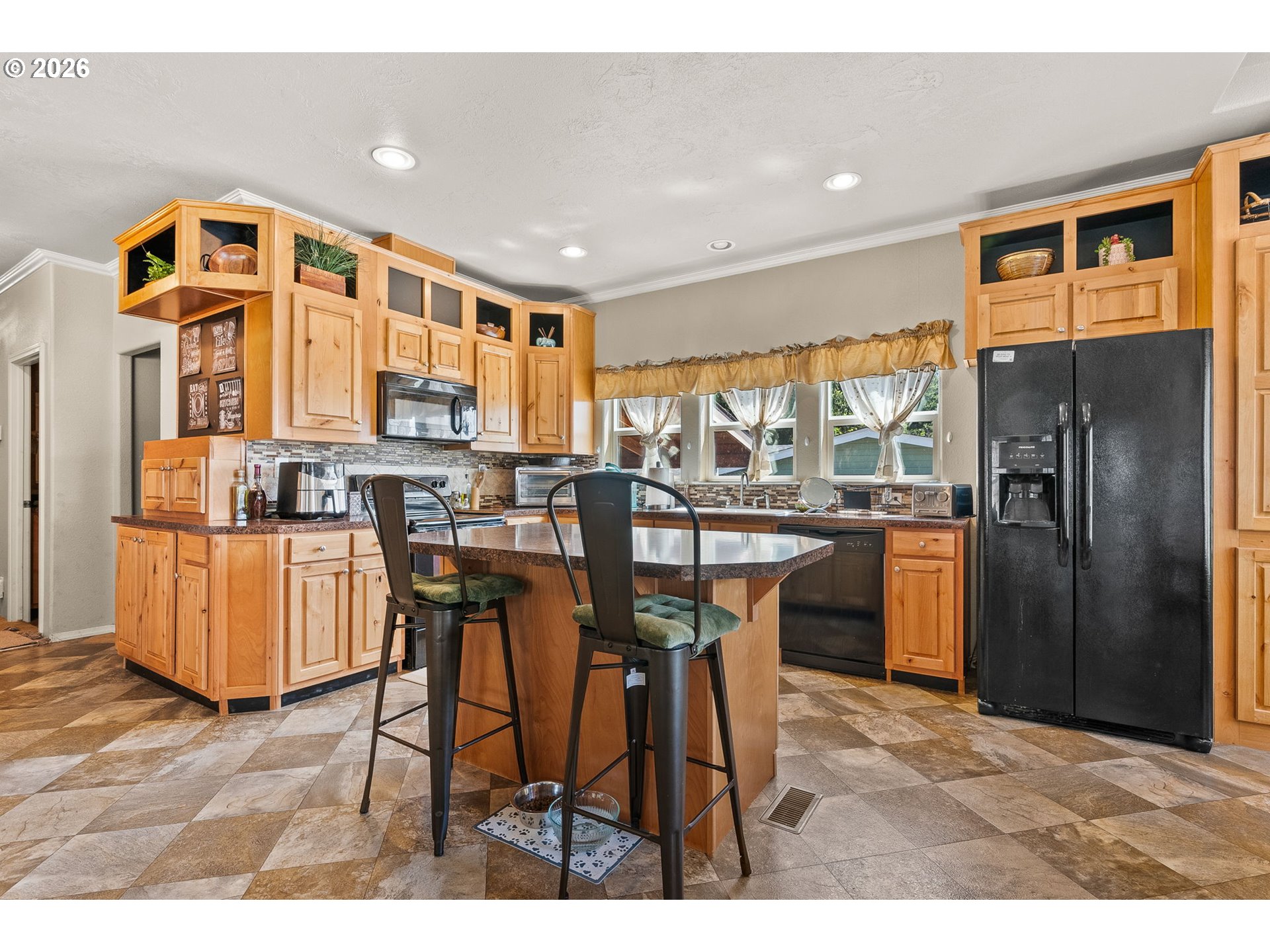 13620 Southwest Beef Bend Road, Unit 1 Portland, OR 97224 - Photo 14 of 34 a view of a dining room with furniture a chandelier and wooden floor